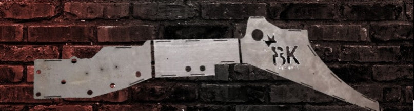 BKFabworks Jeep XJ/MJ front frame stiffener kit displayed against a rugged red and black brick background. Laser-cut weld-on armor for off-road durability BKFabworks Jeep XJ MJ front frame stiffeners – unibody reinforcement plates