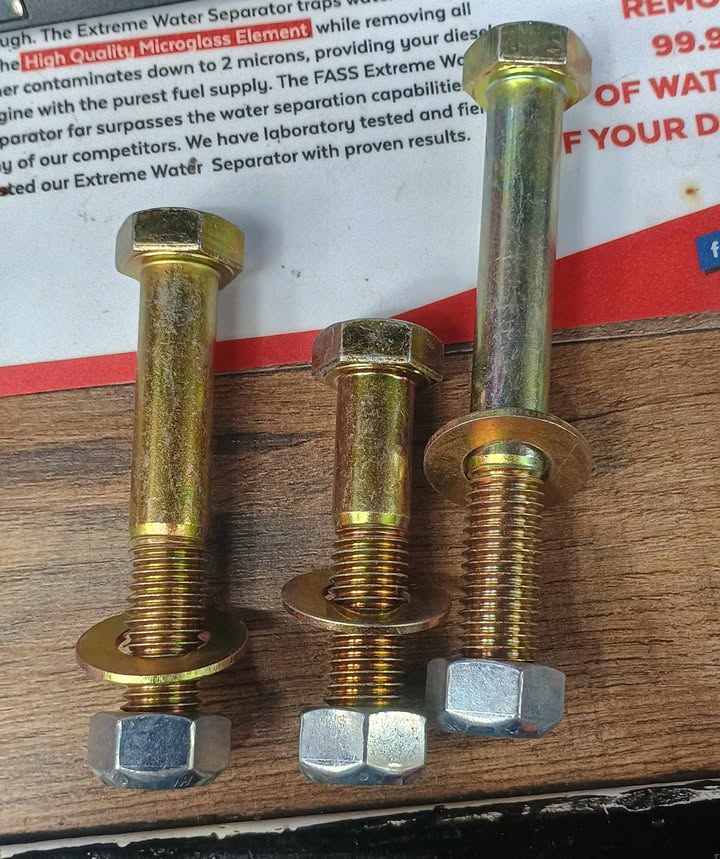 Three zinc-plated Grade 8 bolts with washers and lock nuts from BKFabworks for off-road suspension or steering kits.