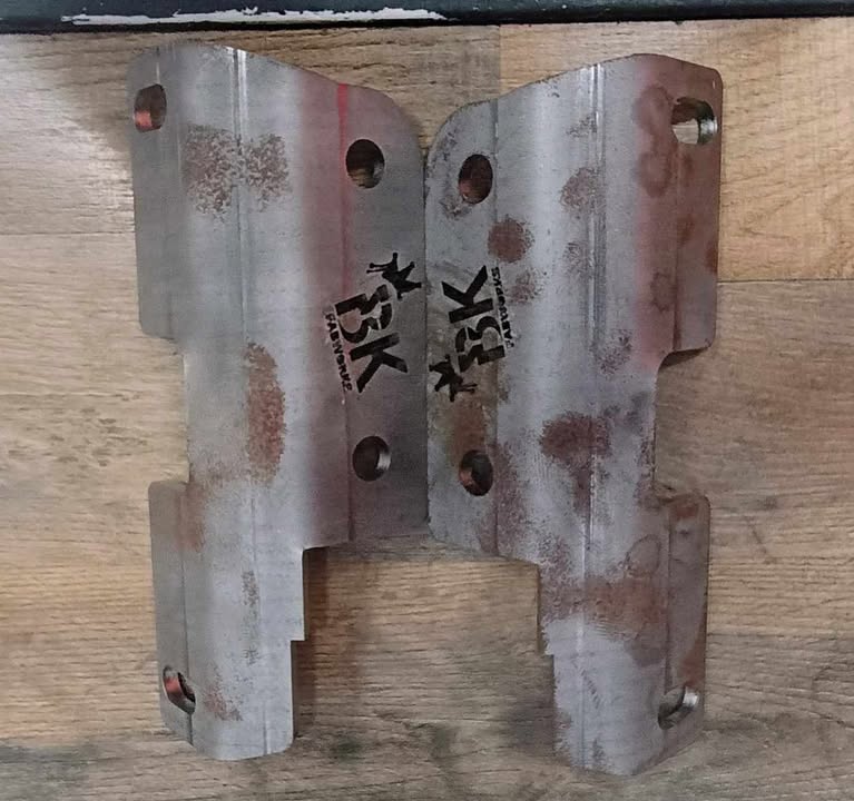 Pair of BKFabworks laser-cut inner C gussets for front axle reinforcement. Weld-on raw steel components for Jeep or Dodge 4x4 applications
