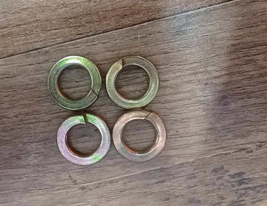 Set of four zinc-plated split lock washers from BKFabworks hardware kits. Designed for secure, vibration-resistant assembly in 4x4 suspension setups