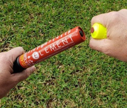 Hands preparing to activate the Element E50 fire extinguisher – compact and easy-to-use fire safety tool for off-road, UTV, and garage use