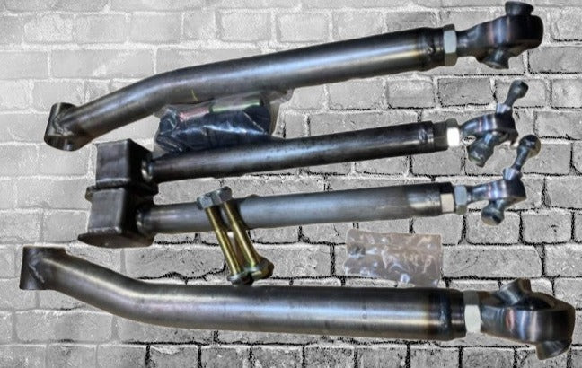 BKFabworks 07–18 Jeep JK/JKU adjustable heim joint control arms kit, including front upper and lower arms with hardware, shown on a gray brick background