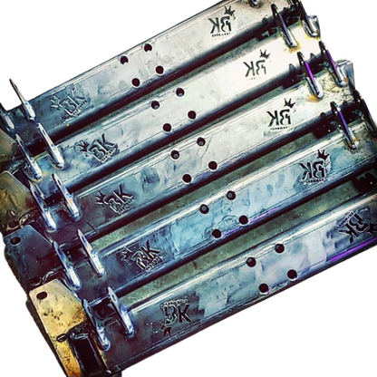 Stacked BKFabworks crossmembers for Jeep Cherokee XJ and MJ 3-link suspension systems, raw steel finish with laser-cut logo