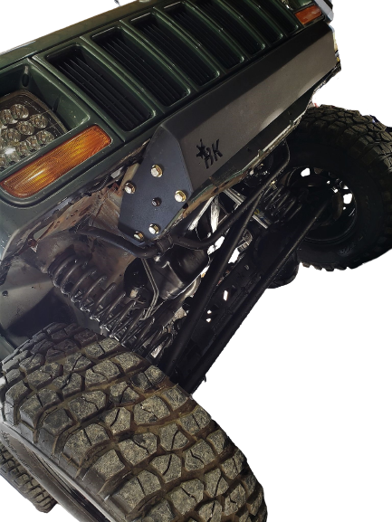 BKFabworks stubby front bumper installed on lifted Jeep Cherokee XJ with upgraded suspension and steering components