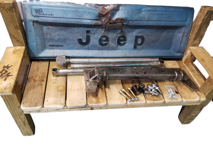 BKFabworks Jeep Cherokee XJ/MJ standard 3-link suspension kit displayed on custom bench with Jeep tailgate and raw metal components